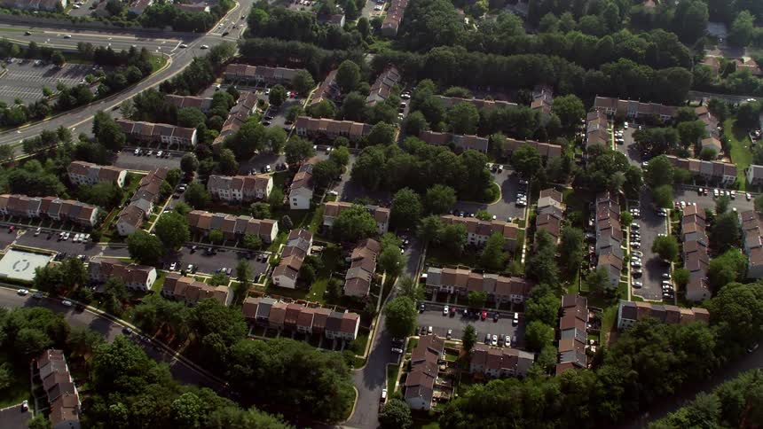 A mesmerizing birds eye view of row houses in Fairfax Virginia tilting down from above
