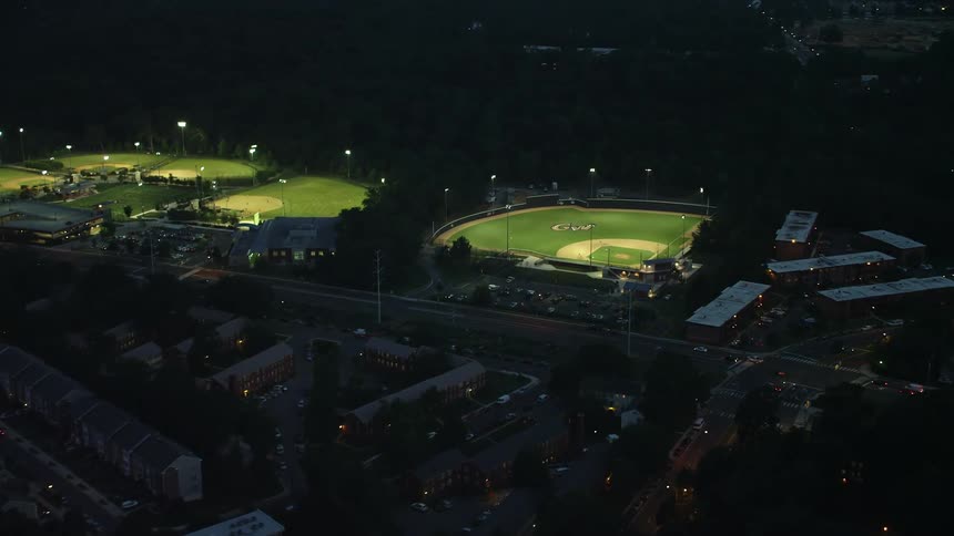 Aerial footage of baseball fields in Barcroft Park Virginia being played on at night