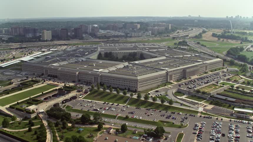 A hazy aerial orbiting around The Pentagon a landmark government building and iconic structure of the United States Department of Defense in Arlington Virginia during daytime