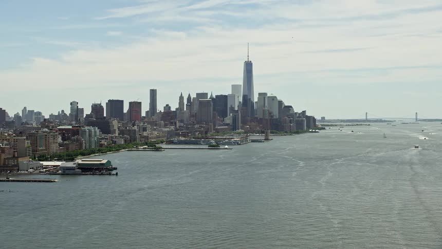 Flying over the Hudson River this aerial footage captures the approach to the iconic Freedom Tower and Lower Manhattan skyline
