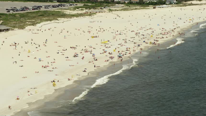 People enjoying a sunny day at Lido Beach NY with a aerial view of the beach and ocean