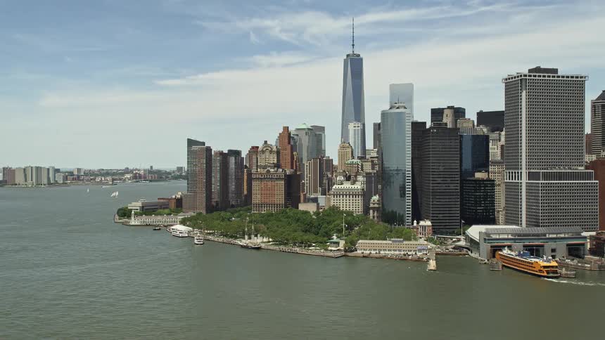 Aerial view of Lower Manhattan skyscrapers Battery Park and World Trade Center on a partly cloudy day in New York City