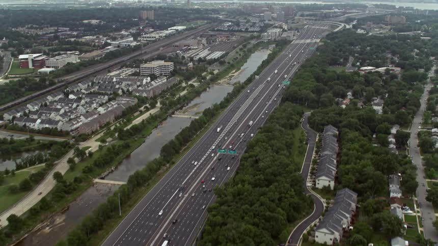 Light traffic is seen on Interstate 95 near suburban residences in Alexandria Virginia from a aerial view in the daytime
