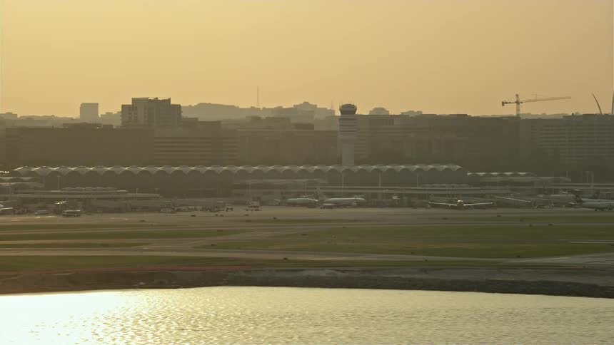 Aerial footage of Ronald Reagan Washington National Airport during sunset showcasing transportation and travel in Arlington Virginia