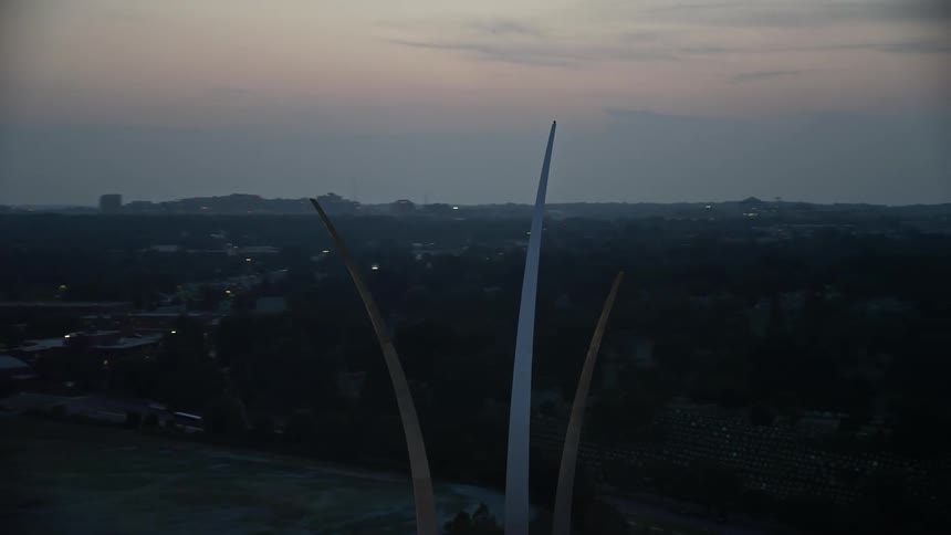 An aerial stock footage orbiting the United States Air Force Memorial at twilight in Arlington Virginia