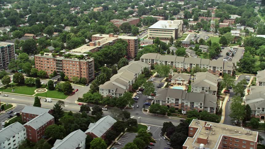 Aerial footage of apartment complexes in Arlington VA on a hazy summer day