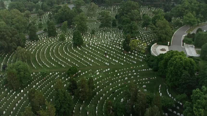 A stunning twilight aerial view over the rows of gravestones in the famous Arlington National Cemetery Virginia serving as resting places for the countrys armed forces and landmarks of national defense history and spirituality