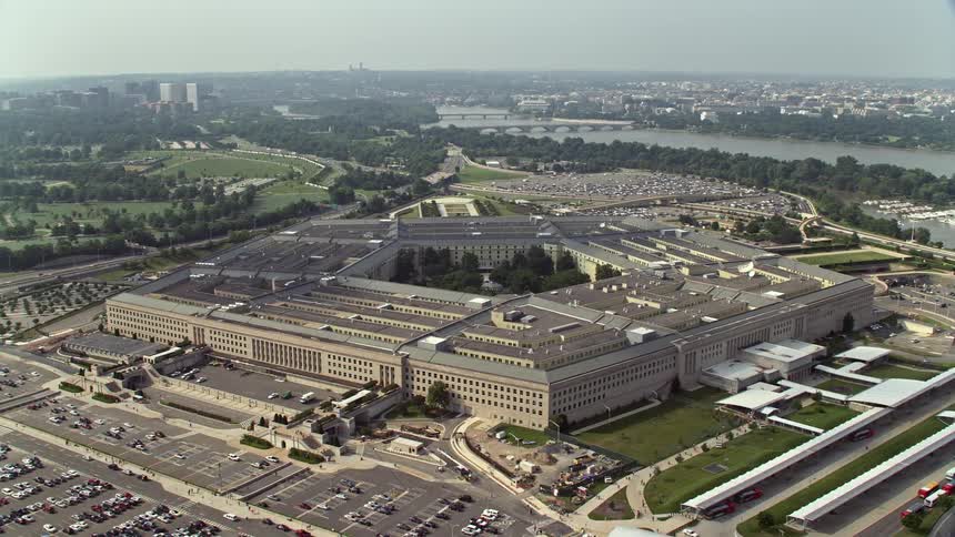 Aerial orbit footage of The Pentagon a government building in Washington DC with the Potomac River in the background during daytime