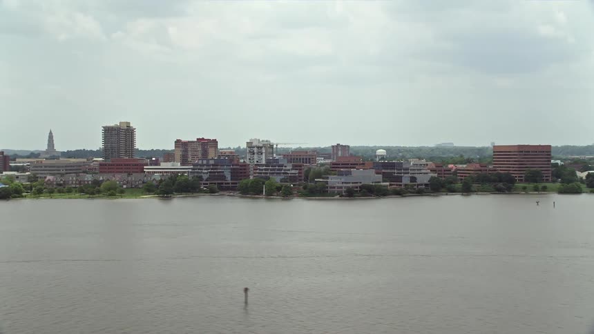 Aerial footage of office buildings by the Potomac River in Alexandria Virginia on a cloudy day