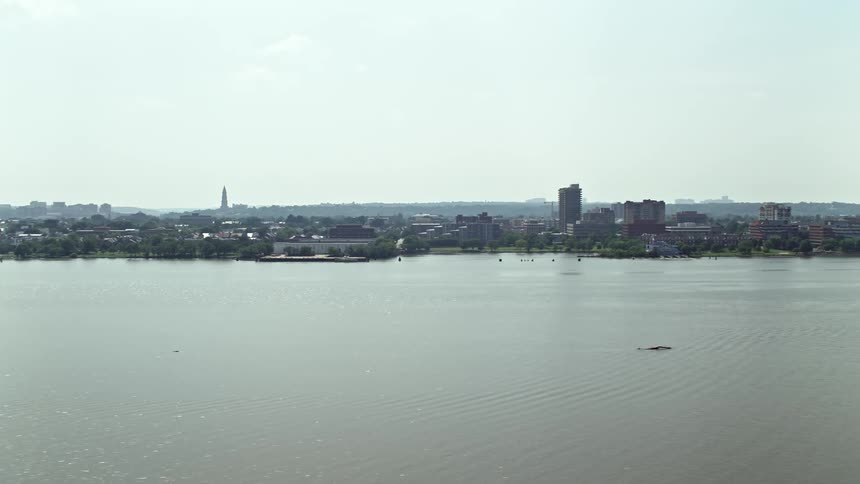 Aerial view of office buildings in Alexandria Virginia across the Potomac River on a hazy day during summer