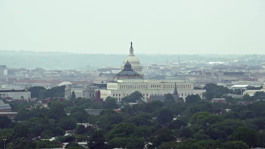 Aerial view of the United States Capitol and Thomas Jefferson Building in Washington DC on a hazy day