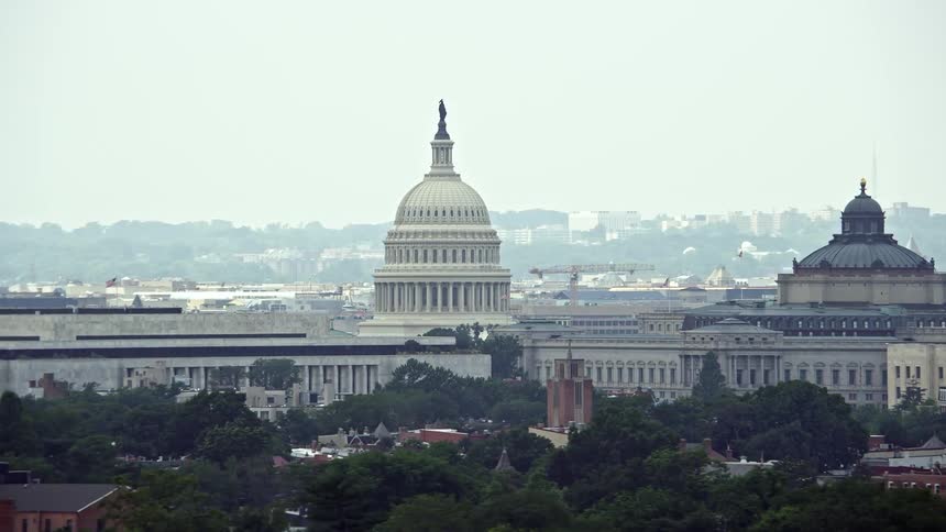 Aerial view of United States Capitol and Library of Congress Buildings in Washington DC on a hazy day