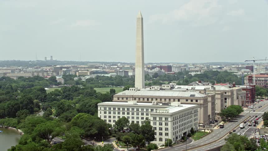 Aerial footage of Washington Monument and nearby government buildings on 14th street Washington DC