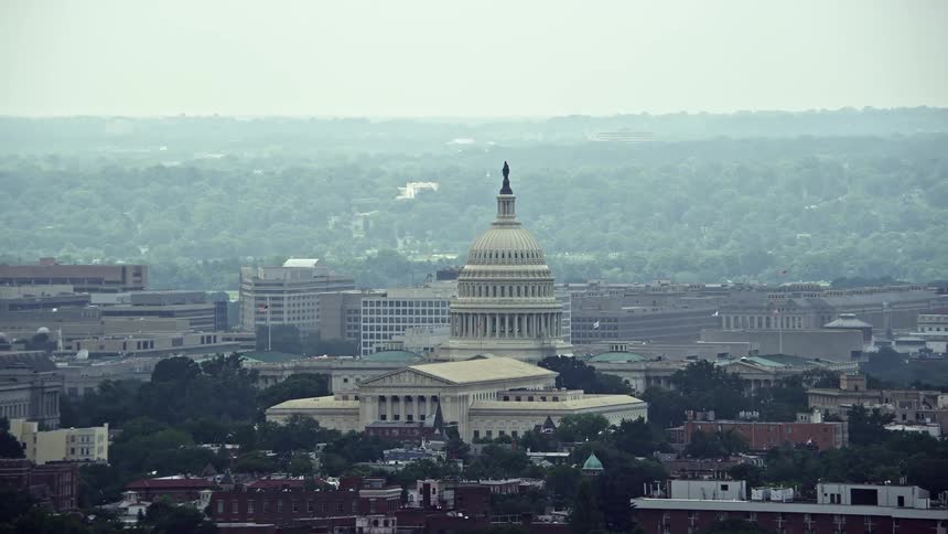 A stunning aerial stock footage showcasing Supreme Court and the United States Capitol in Washington DC amidst haze