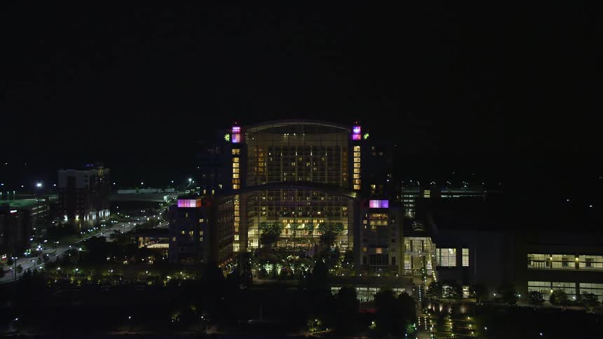 An aerial night view of Gaylord National Resort & Convention Center in National Harbor Maryland showing a clear and beautiful skyline with hotels resorts exhibition and convention centers perfect for leisure recreation and sightseeing
