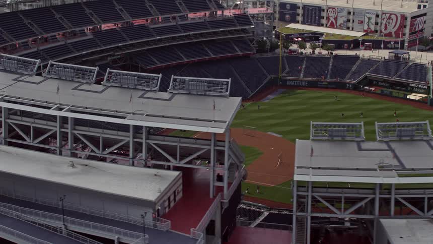 Approaching aerial footage of Nationals Park baseball stadium during daytime in Washington DC