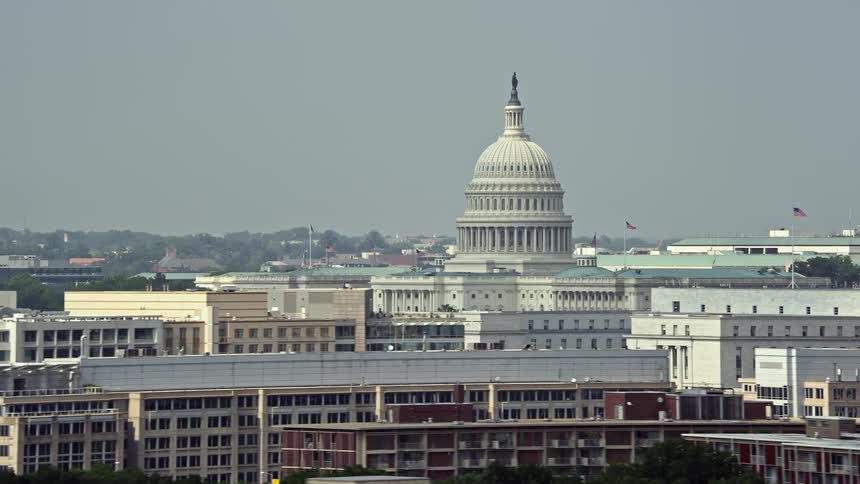 A stunning aerial view of the United States Capitol and Rayburn House Office Building in Washington DC during summer