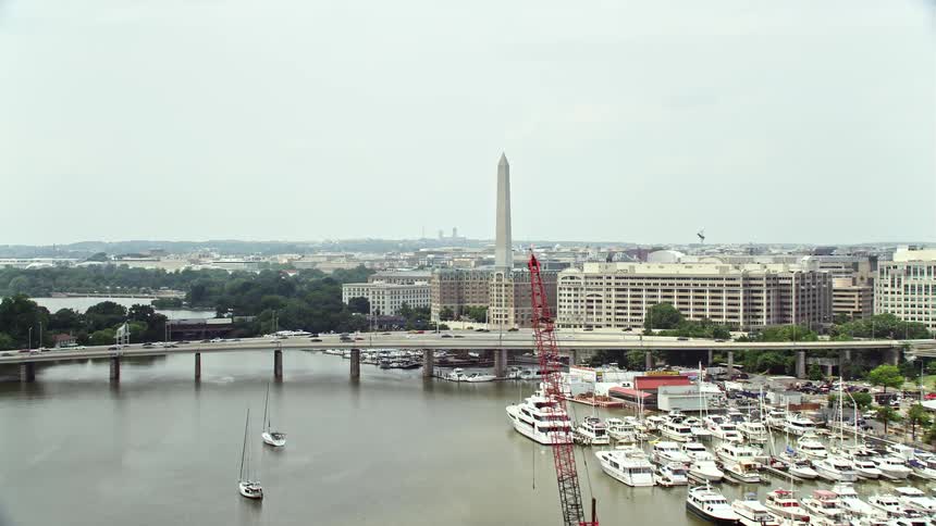 Aerial view of Francis Case Memorial Bridge and nearby office buildings with cloudy skies in Washington DC