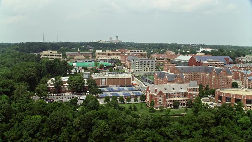 Aerial view of Georgetown Universitys campus surrounded by lush greenery on a cloudy day in Washington DC