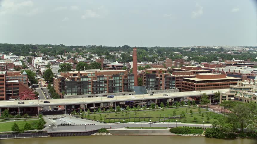 Aerial footage flying beside Ritz-Carlton Residences and Water Front Center office building in Georgetown Washington DC