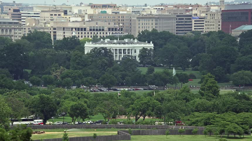 A stunning aerial view of the iconic structure of The White House and the South Lawn in Washington DC during summer