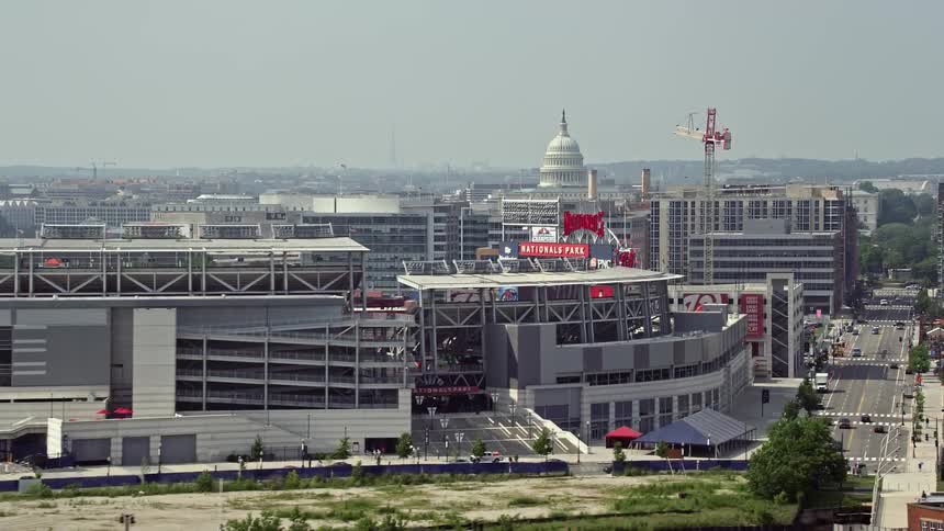 A sunny day time aerial of Nationals Park and the United States Capitol Dome in Washington DC