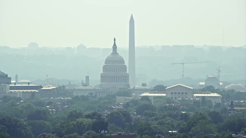 Aerial footage of Washington Monument and the Capitol Building as well as the Supreme Court in Washington DC