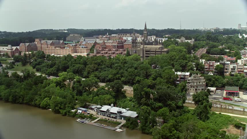 Aerial footage flying over the Francis Scott Key Bridge approaching Georgetown University in Washington DC on a sunny day