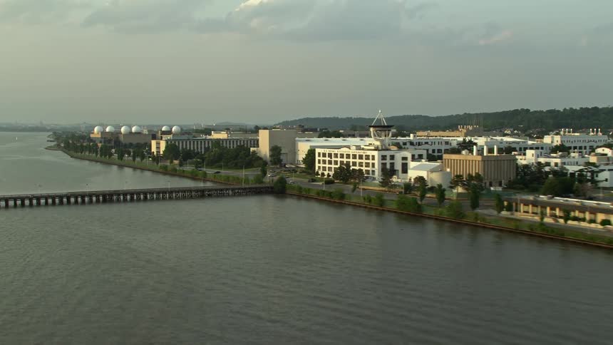 Aerial footage at sunset showing the United States Naval Research Laboratory in Washington DC as well as industrial and military buildings along the coast