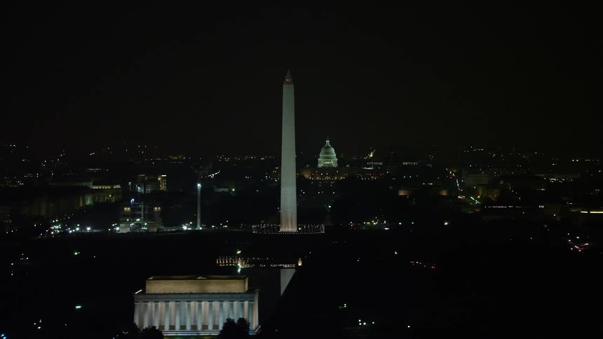 A breathtaking aerial view of Washington DC at night showcasing the Capitol Building Washington Monument and Lincoln Memorial from the Lincoln Memorial