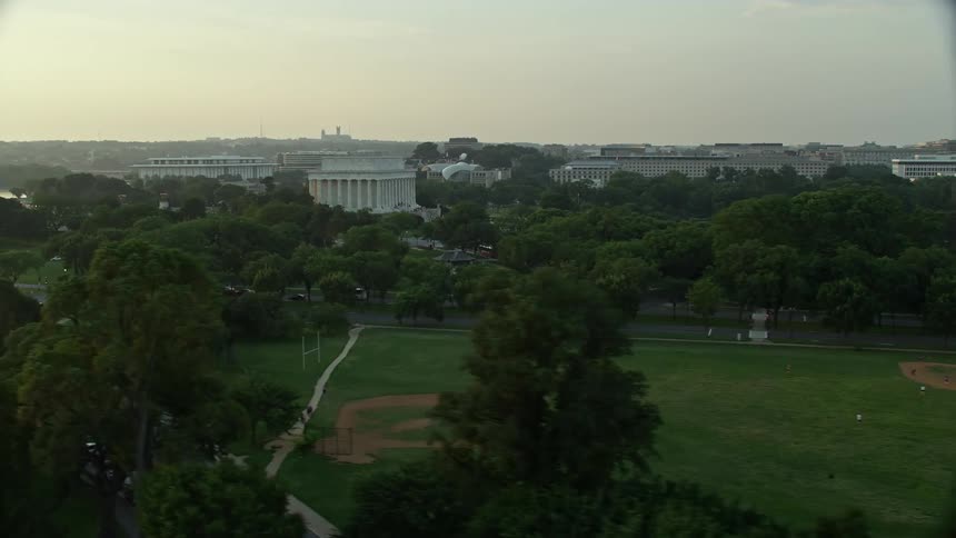 A majestic aerial view of Lincoln Memorial during a hazy sunset in West Potomac Park Washington DC
