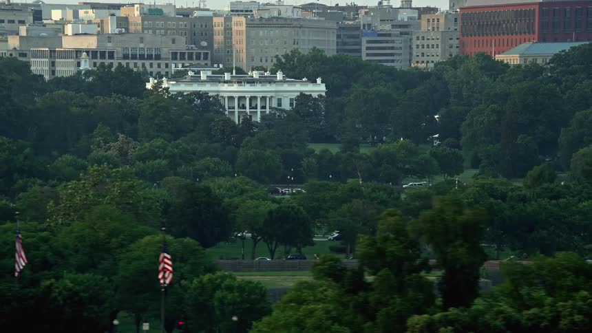 Aerial footage of the famous White House and Washington Monument at sunset in Washington DC