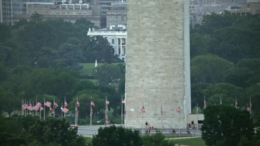 Aerial footage of the White House and Washington Monument at twilight in Washington DC