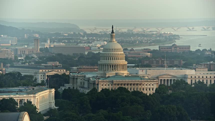 A stunning aerial view of the United States Capitol and the Rayburn House Office Building in Washington DC during sunset