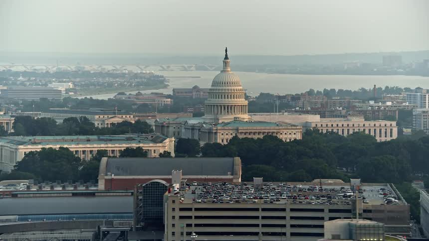 A stunning sunset view of the Russell Senate Office Building and United States Capitol in Washington DC captured in aerial footage