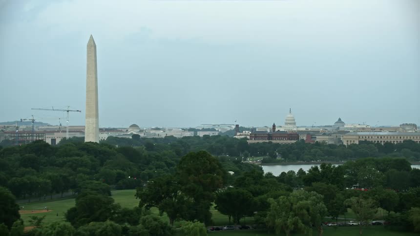 A twilight aerial view of the United States Capitol Washington Monument and Yates Building iconic structures in Washington DC
