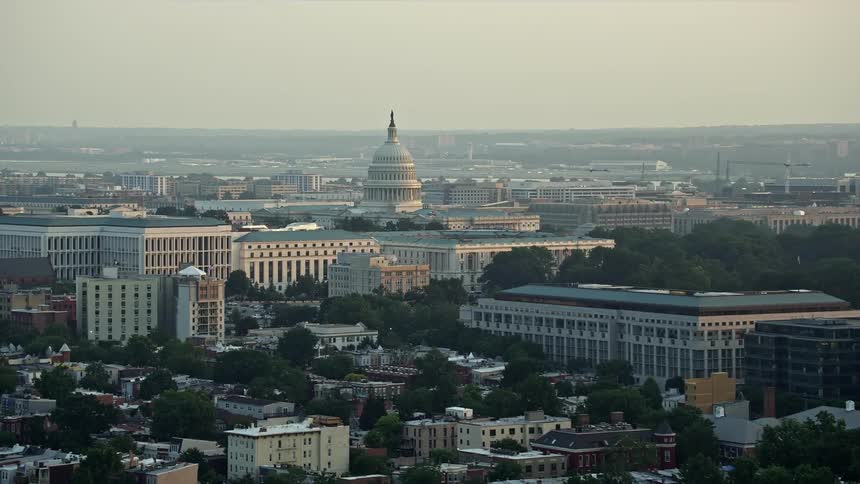 A stunning aerial view of the United States Capitol dome during sunset behind Senate Office Buildings in Washington DC