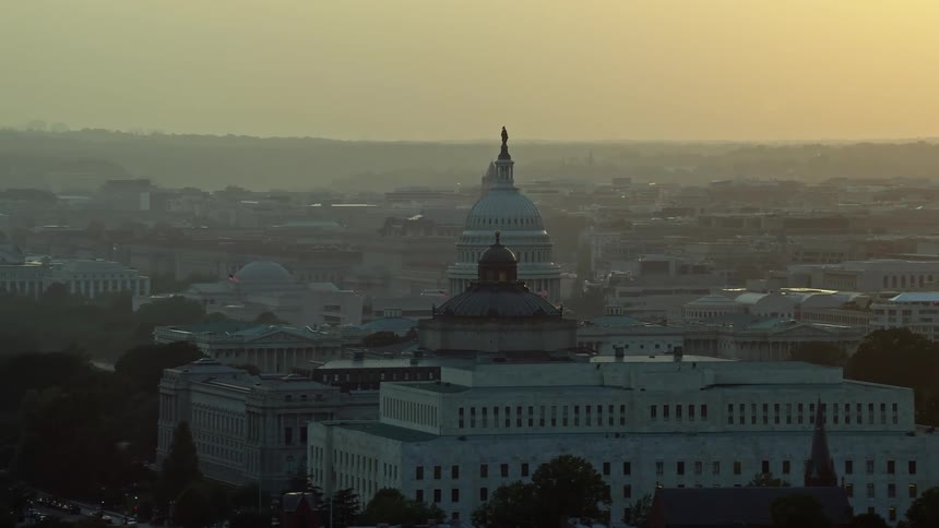 Aerial footage of the United States Capitol Thomas Jefferson and John Adams buildings at sunset in Washington DC