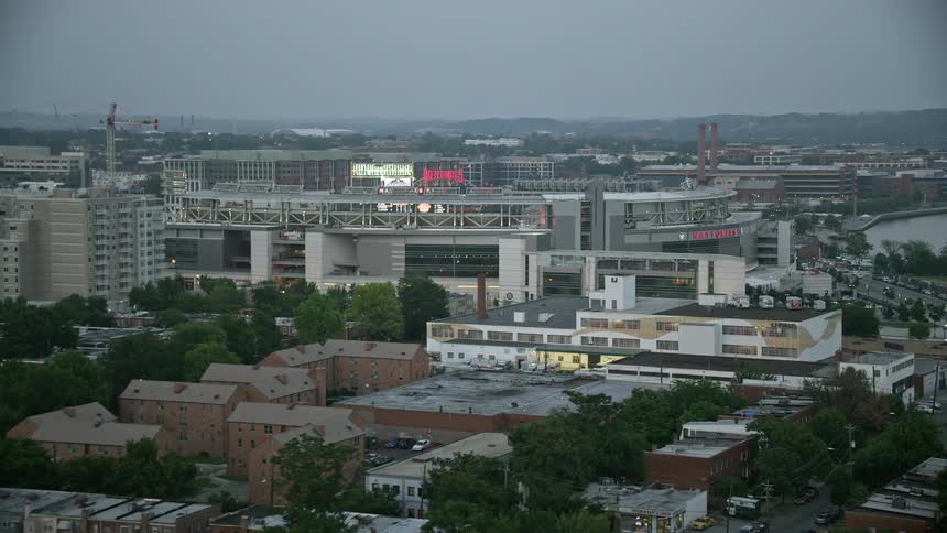 Approaching Nationals Park stadium in Washington DC during twilight from an aerial perspective