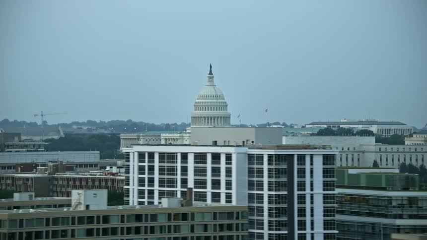 Twilight aerial footage of Washington DCs iconic United States Capitol and surrounding office buildings