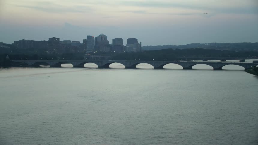 A twilight aerial view of Arlington Memorial Bridge spanning the Potomac River in Washington DC