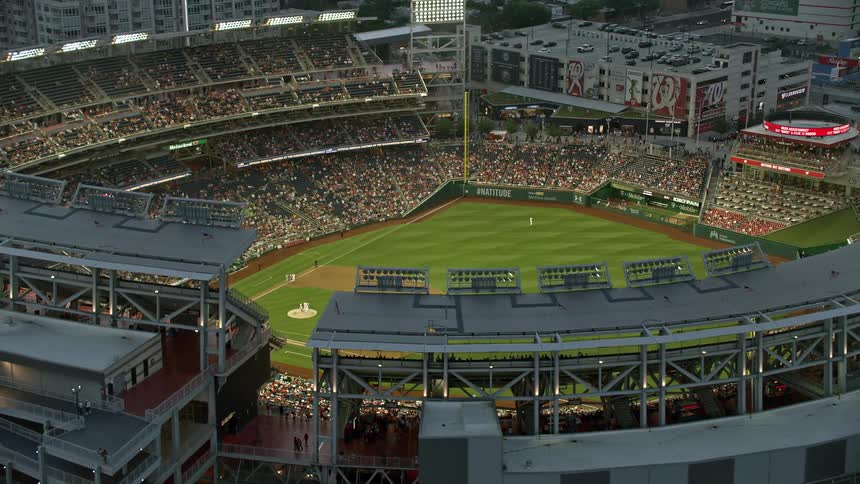 An aerial view of a baseball game at Nationals Park during twilight in Washington DC