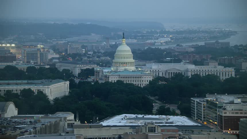 Aerial view at twilight of the United States Capitol and the Rayburn House Office Building two iconic structures of the government in Washington DC