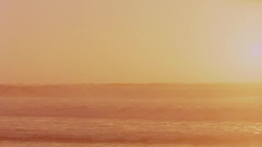 Sunset of a beach on old footage