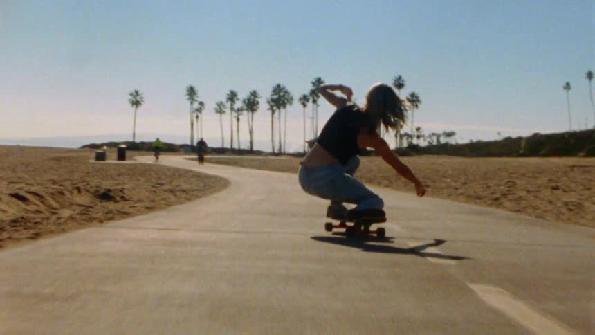 A woman skateboarding