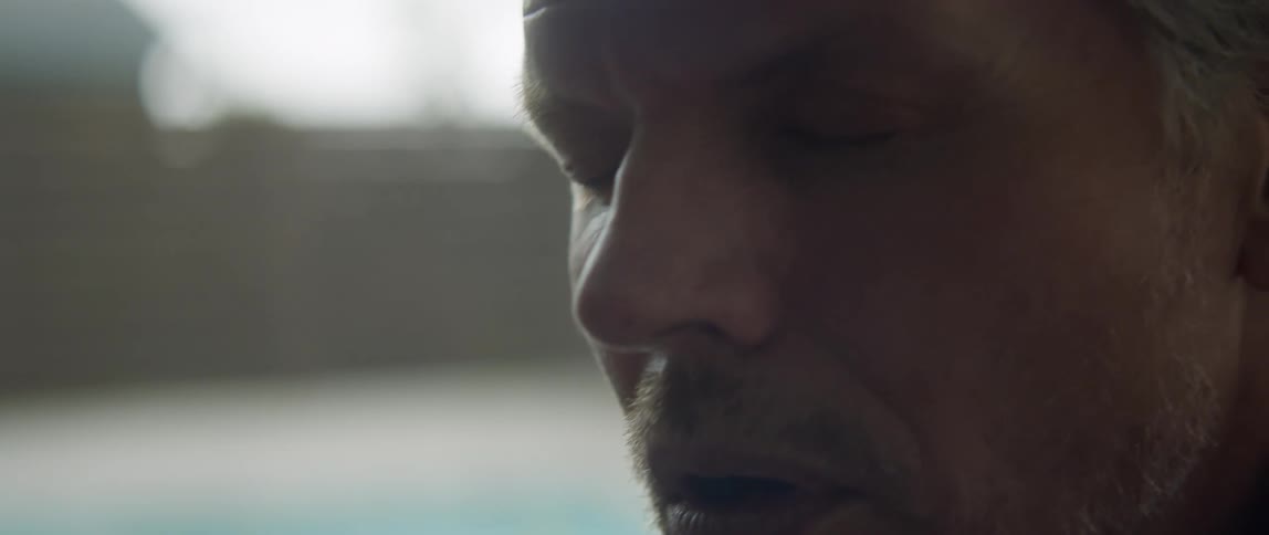Close up of an upset bearded mans face