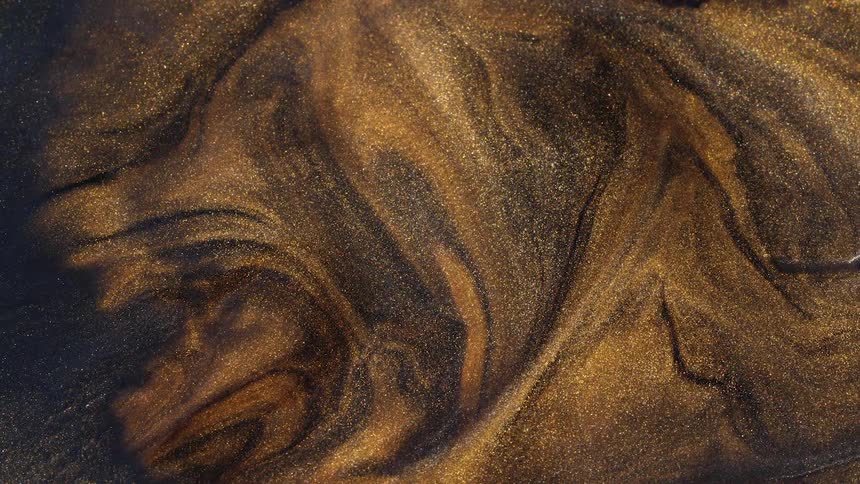 Gold brown and silver paint swirling around