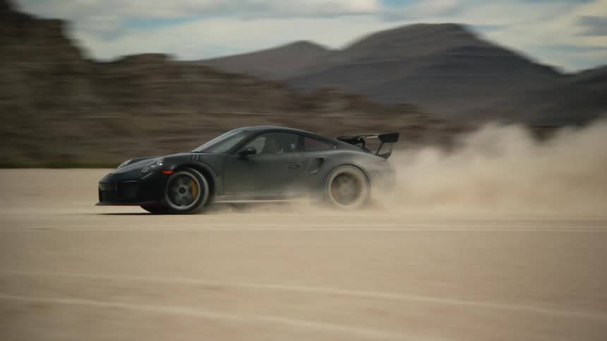 A car is spinning around in the desert