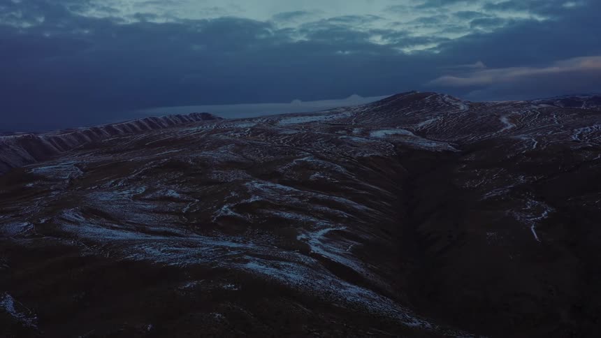 A view of mountains covered with snow