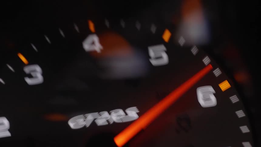 The speedometer needle is moving